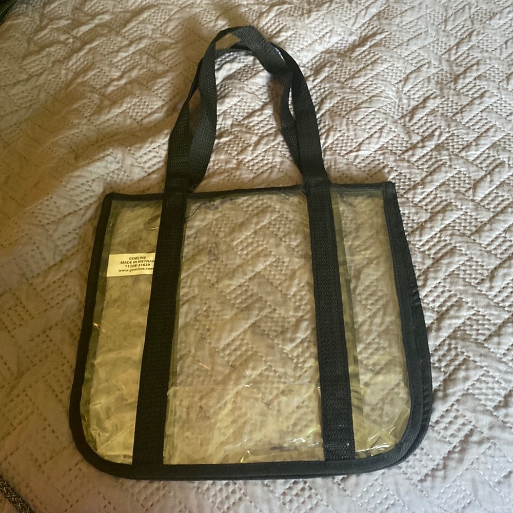 Clear plastic tote bag.